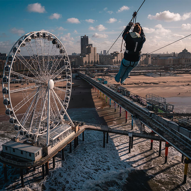 Scheveningen, The Hague, The Netherlands. Ferris wheel and pier at the beach. 