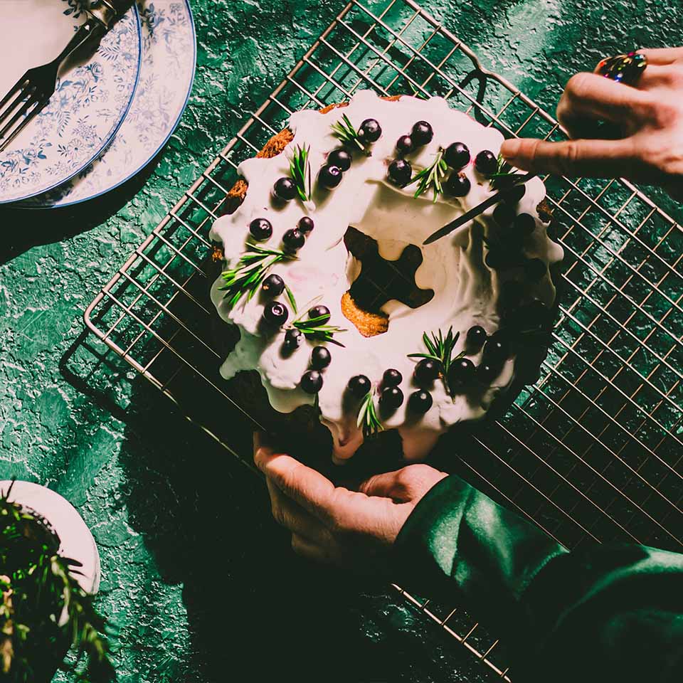 Berry pound cake on a green background.