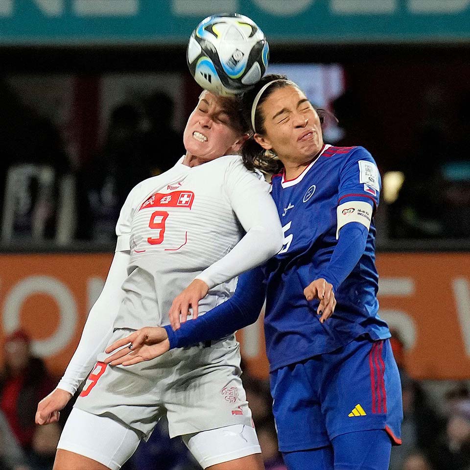 2RDEGMN - Switzerland's Ana Maria Crnogorcevic, left, heads the ball next to Philippines' Hali Long during the second half of the Women's World Cup Group A soccer match between the Philippines and Switzerland in Dunedin, New Zealand, Friday, July 21, 2023