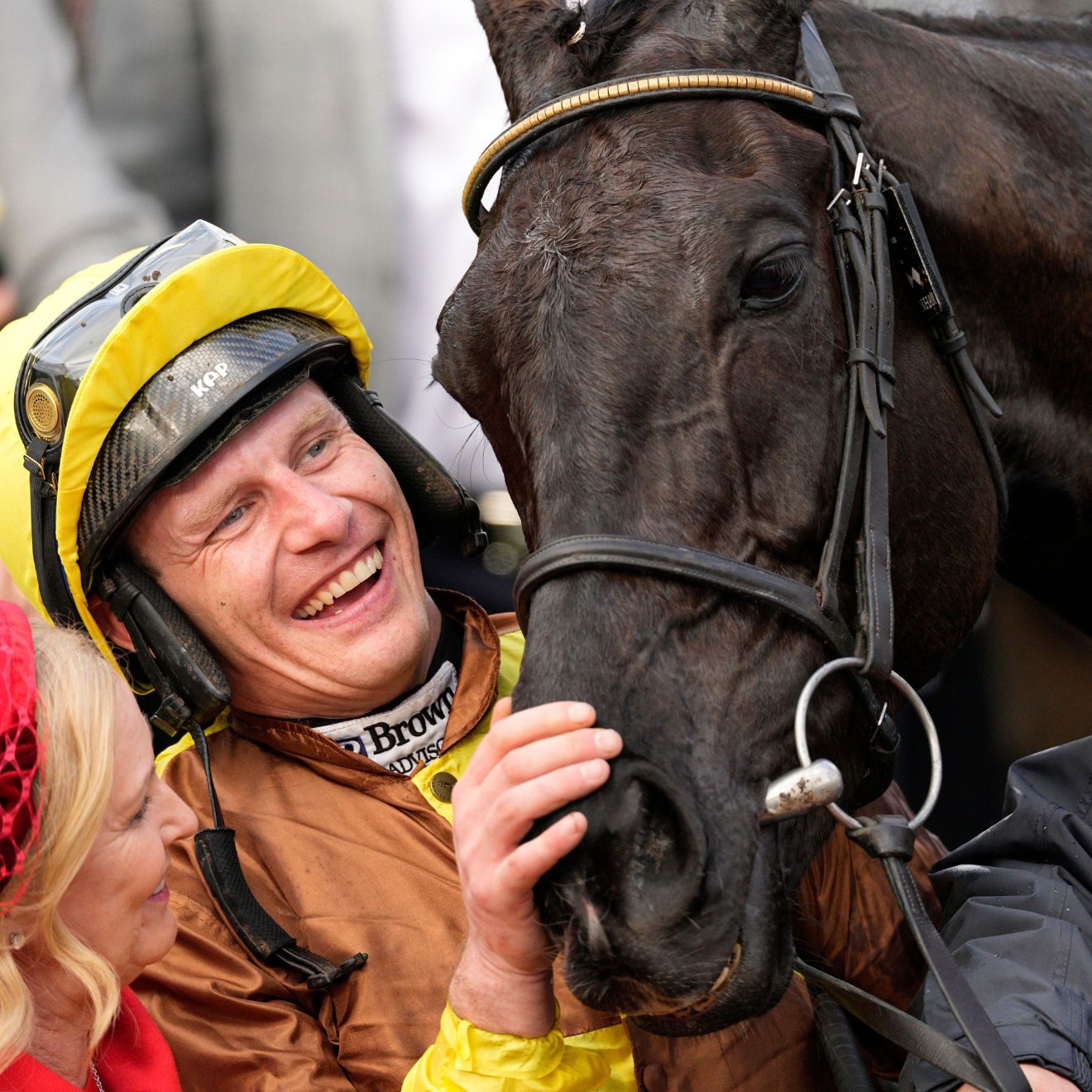 Jockey Paul Townend celebrates with owner Audrey Turley, left, after riding Galloping Des Champs to win the Gold Cup horse race during the final day of the Cheltenham Festival at Cheltenham Racecourse, England,