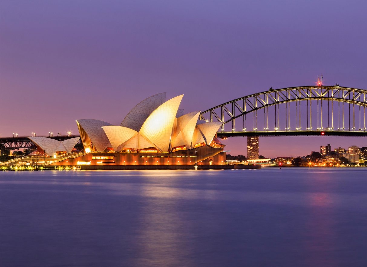SYDNEY, AUSTRALIA, 10 JULY 2015 - Sydney opera house and Harbour bridge in SYdney at sunset. Iconic and world famous landmark of -